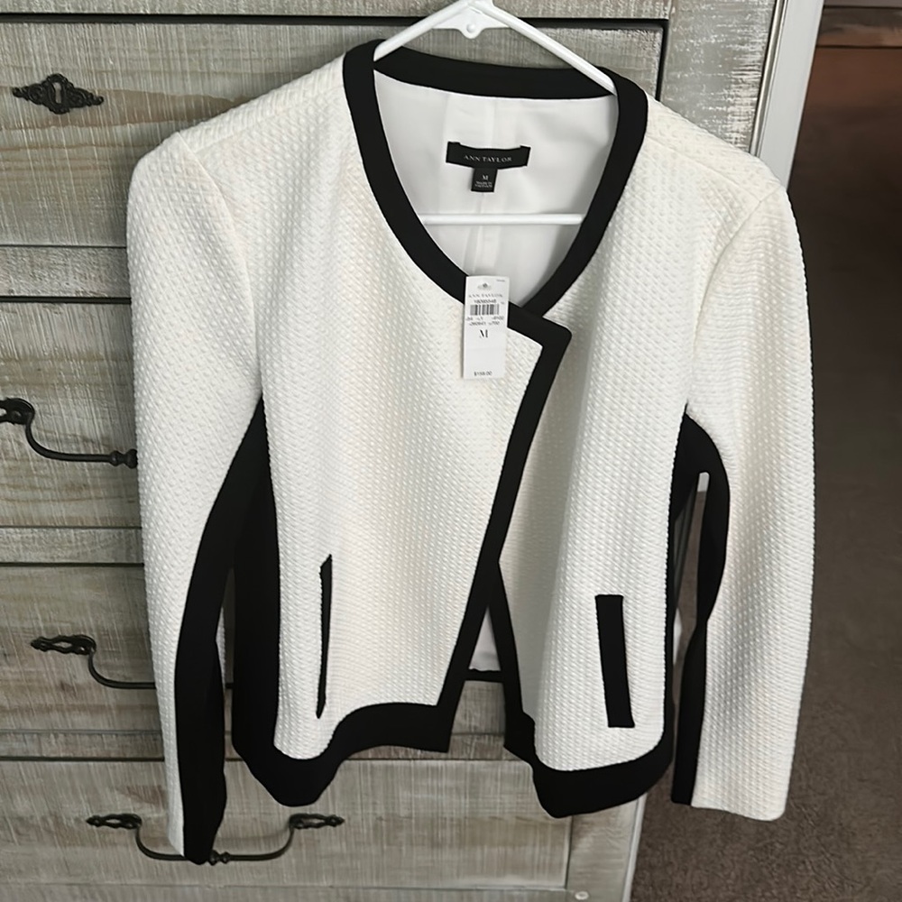 Brand new AT black and white jacket with pockets.